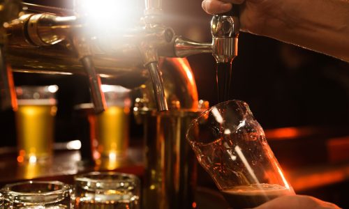 close-up-bartender-pouring-beer-min